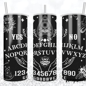 May include: A black and white tumbler with a Ouija board design. The design includes the letters of the alphabet, numbers 1-9, and the words "yes", "no", "goodbye", and "hello".