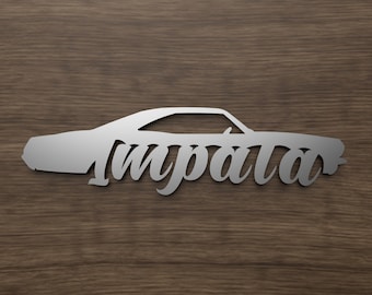 May include: A silver metal silhouette of a classic car with the word "Impala" written in a cursive font.
