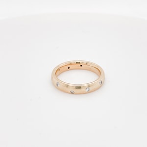 Etoile 14KT solid gold Diamond ring band .