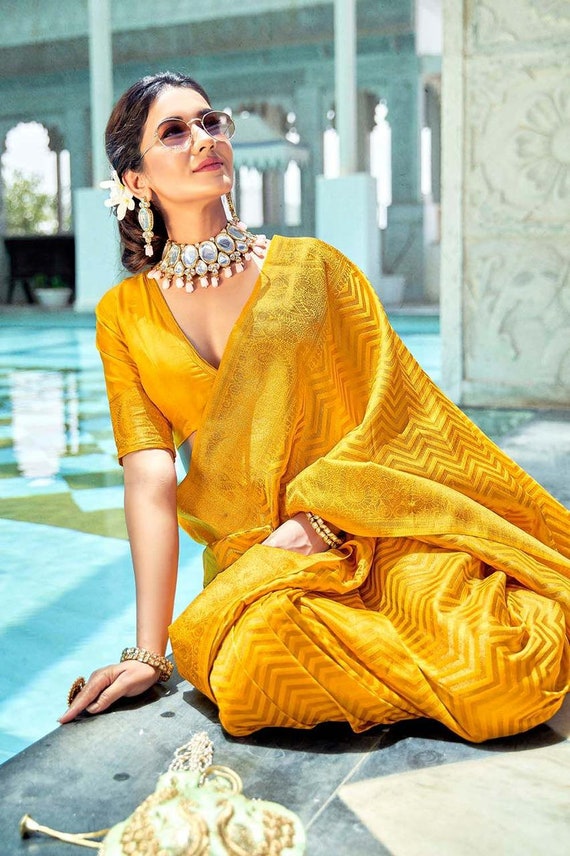 Sunshine girl @amupuri ☀️ Saree @premyabymanishii Earrings and ring  @anmoljewellers Bangles @gehnajewellers1 Potli @eena.official Style… |  Instagram