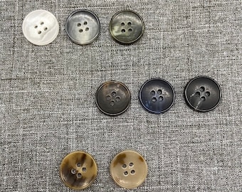 HU001 - 4 hole urea horn button with rim 8 colors 7 sizes.