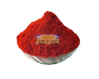 May include: A bowl of bright red chili powder, a popular spice used in cooking. The bowl is filled to the brim with the powder, which has a fine texture. The powder is labeled with the text "परम नत्व".