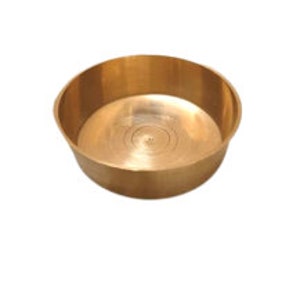 May include: A small, round, brass bowl with a smooth, shiny surface. The bowl has a slightly raised lip around the edge.