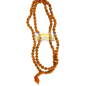 May include: A long, orange, beaded necklace with a tassel at the end. The necklace is made of small, round beads and is called a "Haldi Mala".