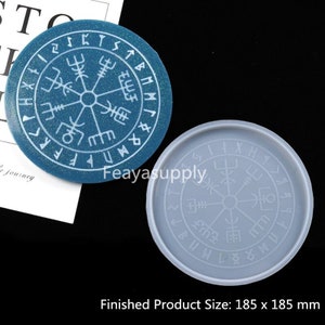 May include: A gray silicone mold for making a resin coaster with a white compass design and runes around the edge. The finished product size is 185 x 185 mm.
