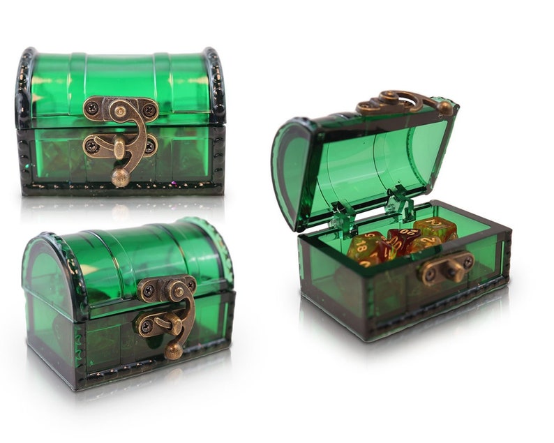 May include: A green plastic treasure chest with a brass latch and hinge. The chest is open and contains several gold dice.