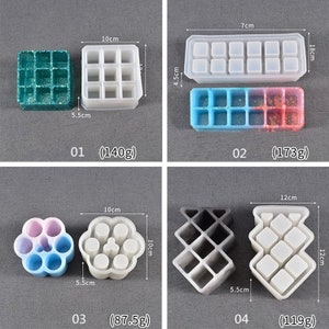 May include: Four silicone molds for making resin crafts. The molds are different shapes and sizes, including a square, a rectangle, a flower, and a geometric design. The molds are all white and have measurements in centimeters.