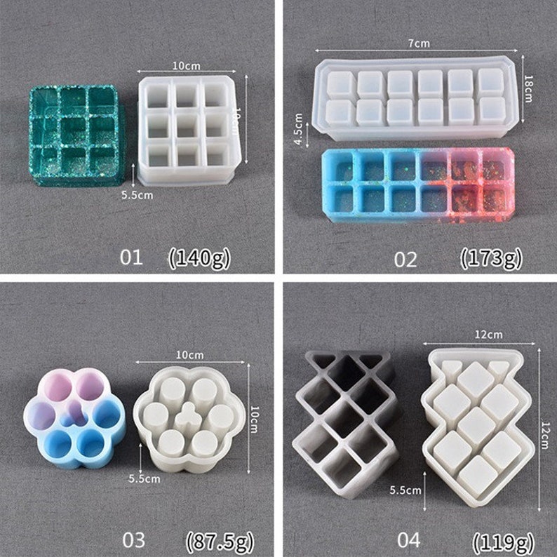 May include: Four silicone molds for making resin crafts. The molds are different shapes and sizes, including a square, a rectangle, a flower, and a geometric design. The molds are all white and have measurements in centimeters.