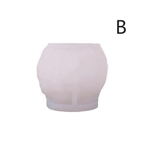 May include: A white, spherical mold with a textured surface. The mold has a flat base and a small support structure. The letter "B" is in the upper right corner.