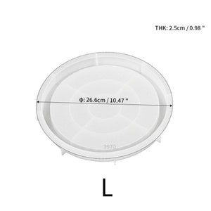 May include: White silicone mold for resin crafts. The mold is shaped like a round plate with a diameter of 10.47 inches and a thickness of 0.98 inches. The mold has a number "3970" printed on it.