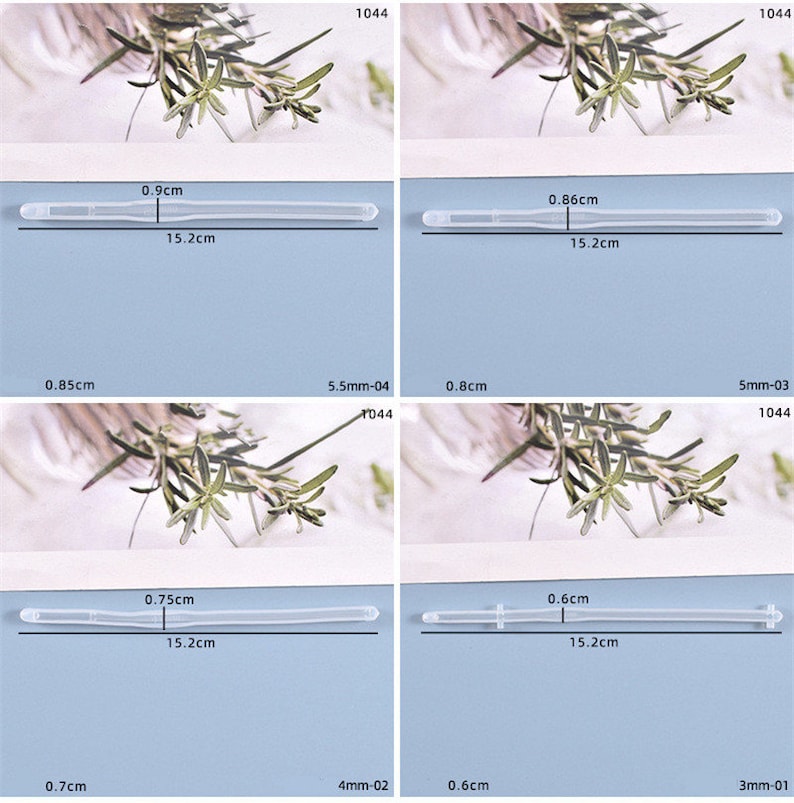 May include: Four clear plastic tubes of different lengths, each measured in centimeters. The tubes are laid out on a white surface with a green plant in the background.