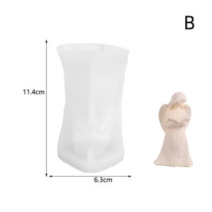 May include: White silicone mould for making a candle in the shape of an angel. The mould is 11.4 cm tall and 6.3 cm wide. The angel is 7.5 cm tall.