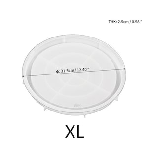 May include: White silicone cake pan with a diameter of 12.40 inches and a thickness of 0.98 inches. The pan has a smooth surface and a raised edge. The pan is labeled "XL" and "3969".