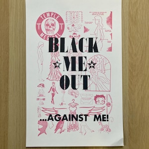 May include: A pink and black poster with the text "BLACK ME OUT...AGAINST ME!" and various illustrations including a skull, a woman, a bird, and a star.