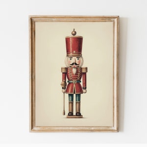 Könnte beinhalten: Eine Vintage-Illustration eines roten und blauen Spielzeugsoldaten-Nussknackers. Der Nussknacker hat eine goldene Krone, einen weißen Schnurrbart und eine rot-goldene Uniform.