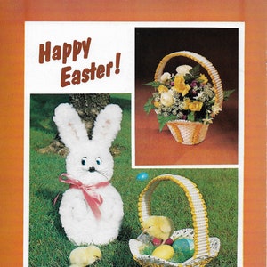 May include: Happy Easter! A white fluffy bunny with a pink bow sits in a grassy area with two yellow chicks. A white and yellow basket with a yellow handle is filled with colorful eggs and a yellow chick. A white and yellow basket with a yellow handle is filled with yellow flowers.