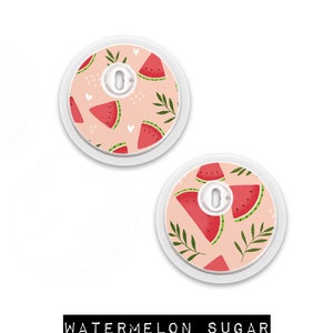 May include: Two white medical device covers with a watermelon pattern on a light pink background. The design includes red watermelon slices, green leaves, and white hearts. The text "WATERMELON SUGAR" is at the bottom.