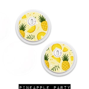 May include: Two round, white medical device covers with a yellow pineapple pattern. The design includes whole pineapples, slices, and leaves on a light yellow background. The text "PINEAPPLE PARTY" is displayed in a black rectangle.