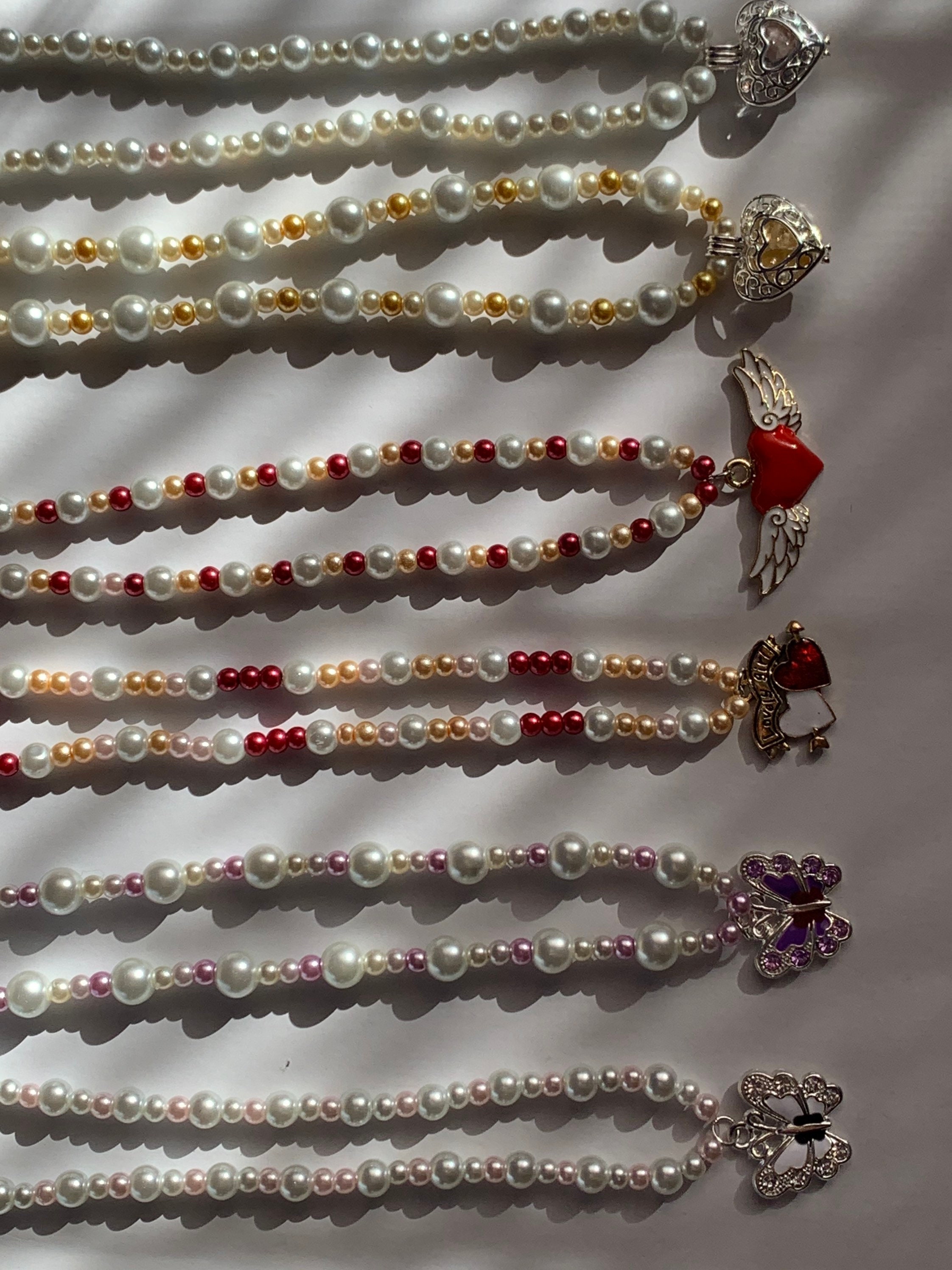 Pearl charm necklace. Etsy