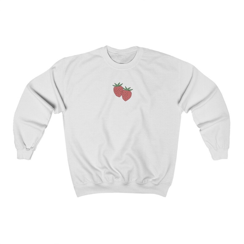 May include: White sweatshirt with a small embroidered image of two red strawberries on the front.