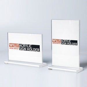 May include: Two clear acrylic sign holders with a black and red logo that says "WILLIT ACRYLIC RETAIL DISPLAY SIGN HOLDER".