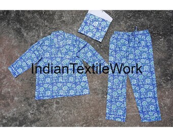 May include: A blue and white patterned pajama set with a long-sleeved top and pants. The set includes a matching sleep mask.