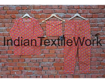 May include: A three-piece pajama set with a floral pattern in shades of red, yellow, and orange. The set includes a long-sleeved top, pants, and a small pouch. The words "Indian Textile Work" are printed on the image.