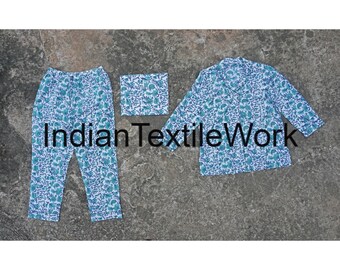 May include: A white pajama set with a blue floral pattern. The set includes a long-sleeved top and pants. The top has a collar and a button closure. The pants have an elastic waistband.
