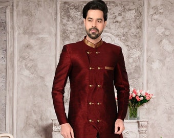 May include: A maroon long-sleeved kurta with gold trim and buttons, paired with gold dhoti pants and beige shoes.