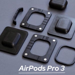 May include: An assortment of black accessories for AirPods Pro 3, including square and rectangular pieces with rounded edges and a curved piece. The text "AirPods Pro 3" is displayed at the bottom of the image.