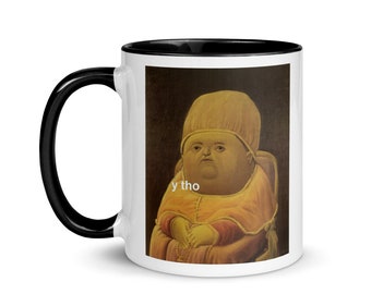 May include: White ceramic mug with a black rim and handle. The mug features a printed image of a Renaissance-style painting of a person with a round face and a pink hat. The text "y tho" is printed below the image.