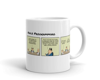 May include: White ceramic mug with a cartoon illustration of a meeting about agile programming. The text on the mug reads "Agile Programming" and includes the following dialogue: "We're going to try something called Agile Programming", "That means no more planning and no more documentation. Just start writing code and complaining", "I'm glad it has a name."