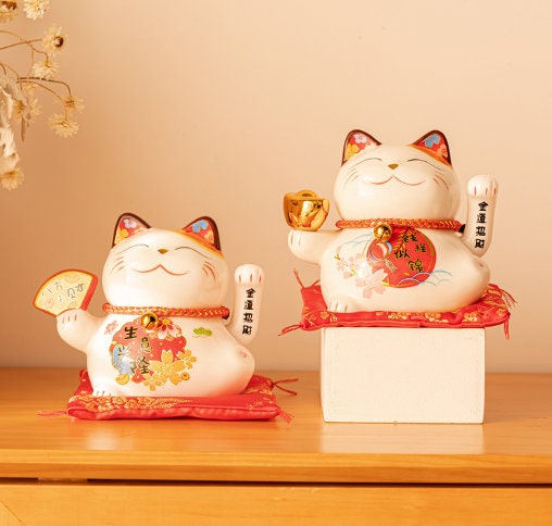 Maneki Neko ceramic japanese lucky cat isolated on white background Stock  Illustration by ©mraoraor #178025464