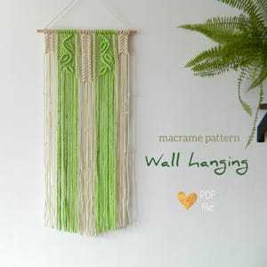 May include: A macrame wall hanging pattern in PDF format. The pattern features a green and white macrame wall hanging with a geometric design.