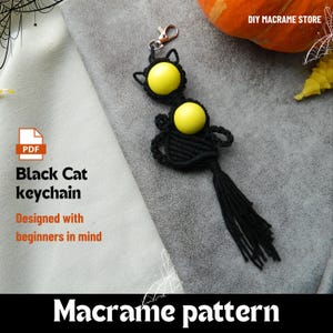 May include: Black macrame cat keychain with yellow bead eyes and a tassel tail. The keychain is black and has a silver clasp. The image also includes text that says "Black Cat keychain" and "Macrame pattern".