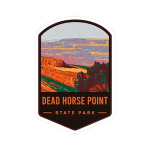 May include: A sticker featuring a landscape illustration of Dead Horse Point State Park. The design includes a colorful canyon scene with the text "DEAD HORSE POINT STATE PARK" in bold letters. The sticker has a dark brown border.