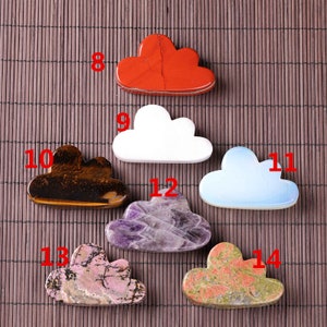 May include: Ten cloud-shaped polished stones in various colours, including red, white, brown, blue, purple, pink, and green. The stones are numbered 8 through 14.