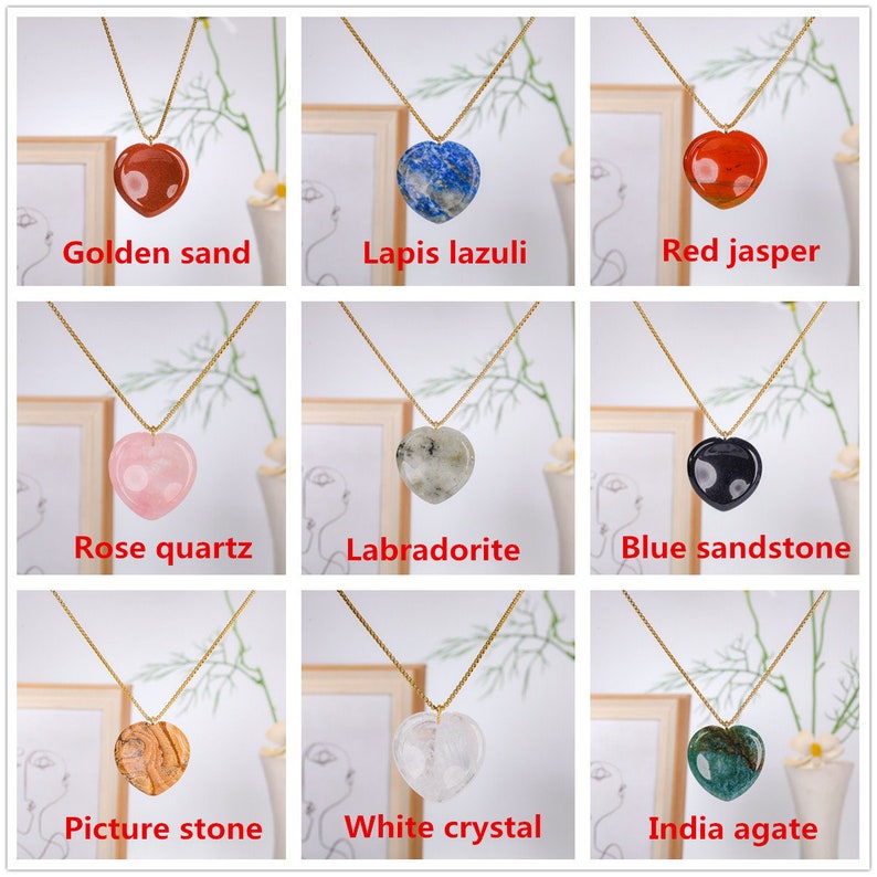 May include: Nine gold necklaces with heart-shaped pendants made of different types of stones. The stones are: golden sand, lapis lazuli, red jasper, rose quartz, labradorite, blue sandstone, picture stone, white crystal, and India agate.
