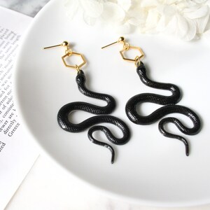 Black Gold Resin Snake Earrings image 2