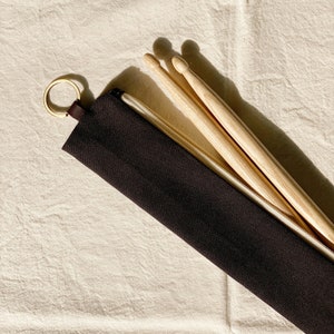 Housse en toile noire pour baguettes de batterie