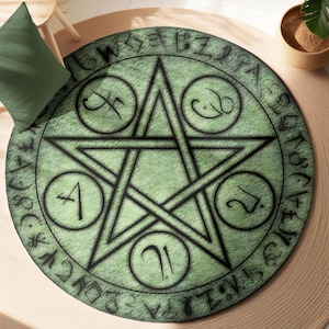 May include: A green and black round rug with a five-pointed star in the center. The star is surrounded by a circle with symbols and text. The rug has a distressed, vintage look.