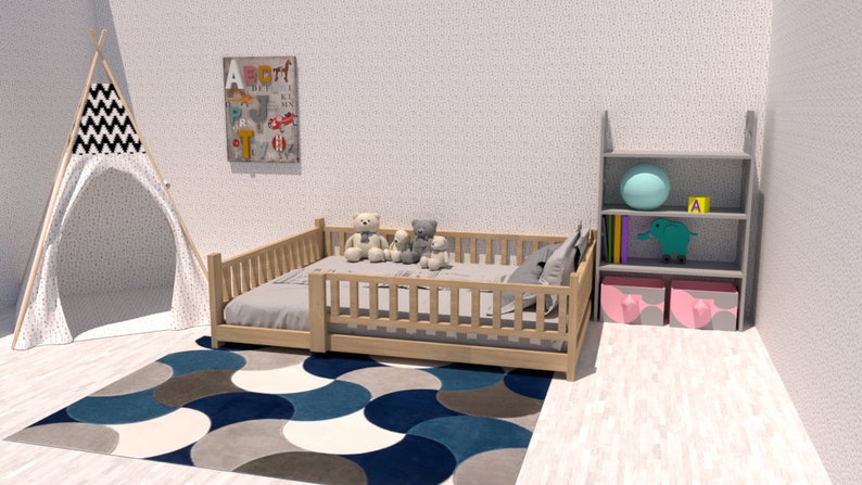 May include: A wooden toddler bed with a white mattress and a blue and gray patterned rug. There are stuffed animals on the bed and a teepee tent in the background.