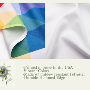 May include: A colorful fabric with a geometric pattern in shades of blue, green, yellow, orange, and red. The fabric is folded over and has a white border. The text "Printed to order in the USA - Vibrant Colors - Made w/ mildew resistant Polyester - Durable Hemmed Edges" is printed below the fabric.