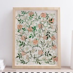 May include: A framed print of a botanical illustration featuring a repeating pattern of white and orange flowers with green leaves on a white background.