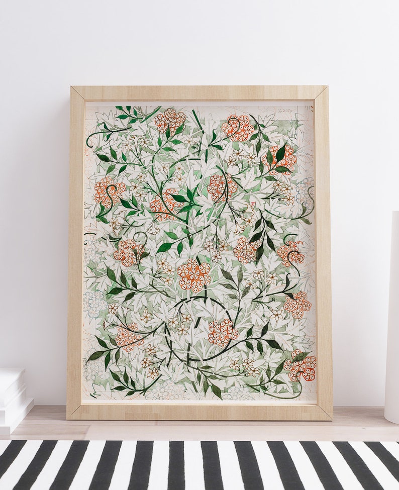May include: A framed print of a botanical illustration featuring a repeating pattern of white and orange flowers with green leaves on a white background.