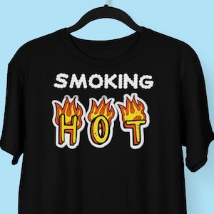 May include: Black t-shirt with the text "SMOKING HOT" in white with flames behind the letters.