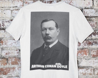 May include: White t-shirt with a black and white photo of Arthur Conan Doyle printed on the back. The text "ARTHUR CONAN DOYLE" is printed below the photo.