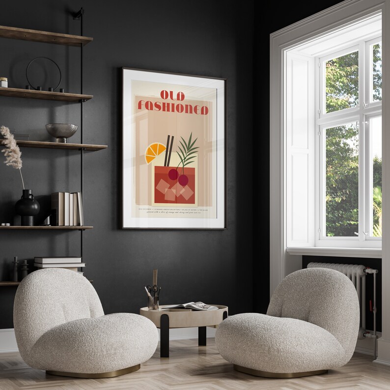 May include: A minimalist poster with a graphic illustration of an Old Fashioned cocktail. The poster is framed and hanging on a black wall in a living room setting.
