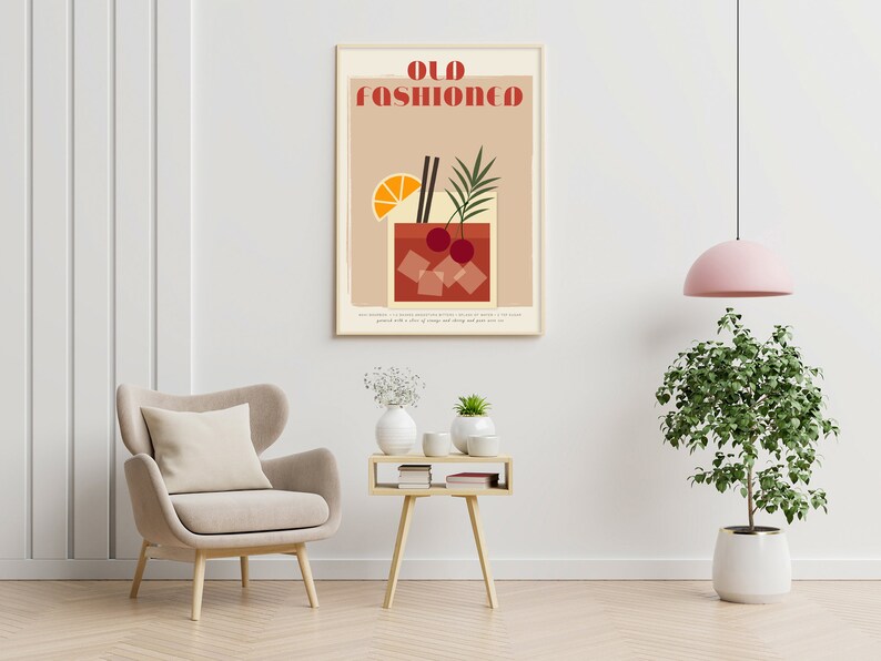 May include: A minimalist poster with the text "Old Fashioned" in red and white letters. The poster features a stylized illustration of an Old Fashioned cocktail with a cherry, orange slice, and two straws. The background is a light brown color.