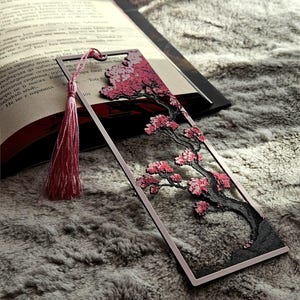 May include: A handmade wooden sign with the text "Welcome to our home" in a handwritten style. The sign is painted white with black lettering and a distressed finish, perfect for home decor.